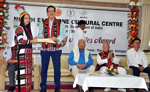 Deputy Chief Minister of Arunachal Pradesh Shri Chowna Mein giving away the award to an awardee  during the Young talented Artist Award ceremony in Darbar Hall, Raj Bhavan, Itanagar on 25th August 2017